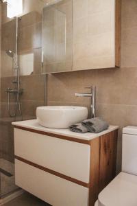 a bathroom with a sink and a toilet at Villa Christina 2 in Ohrid