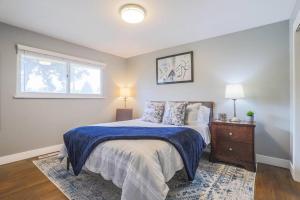 a bedroom with a large bed and a window at NEW Modern Home w/ Beautiful Finishes! in Denver