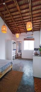 a bedroom with two lights and a bed in a room at Kite House Cabarete across Kite Beach in Cabarete