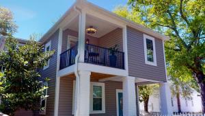 a house with a balcony on top of it at Modern 2BR 2BA with King bed-Fast Wi-Fi 75 inch OLED TV in Wilmington