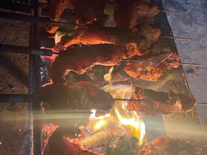 a group of food cooking on a grill at Cloud 9 Homestay in Attigundi