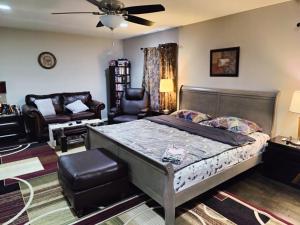 a bedroom with a bed and a living room at Luxurious stay at prime location in Herndon