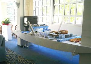 a long table with food on it in a room at Hotel Maremonti in Gabicce Mare