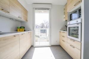 Kuchyňa alebo kuchynka v ubytovaní Le Michelet - Appart 2 ch avec terrasse et parking