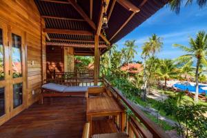 a porch of a resort with a view of the beach at Mango Beach Resort in Phu Quoc