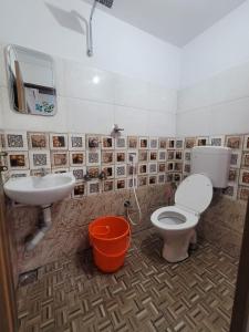 a bathroom with a toilet and a sink at Private Room! Alleppey Villa! in Alleppey