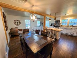 a dining room and kitchen with a table and chairs at Cozy Corner in Denison
