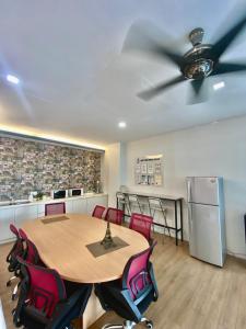 a dining room with a table and a ceiling fan at Best View Hotel Sunway Mentari in Petaling Jaya
