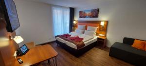 Postel nebo postele na pokoji v ubytování Hotel Amber Altstadt