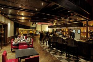 Um restaurante ou outro lugar para comer em Hotel Posada Los Alamos