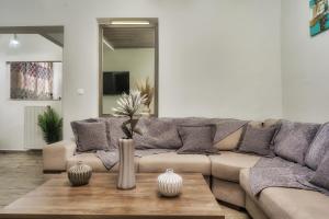 a living room with a couch and a table at Little Gem in Zakynthos