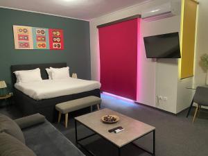 Ένα ή περισσότερα κρεβάτια σε δωμάτιο στο Connect Suites