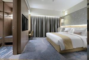 Letto o letti in una camera di Caesar Park Hotel Banqiao