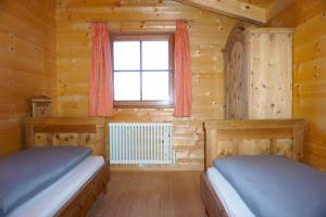 Posteľ alebo postele v izbe v ubytovaní Bergchalet Refugium Martius