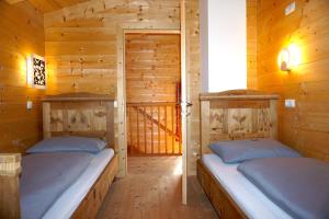 Posteľ alebo postele v izbe v ubytovaní Bergchalet Refugium Martius