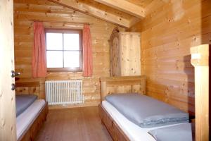 Posteľ alebo postele v izbe v ubytovaní Bergchalet Refugium Martius