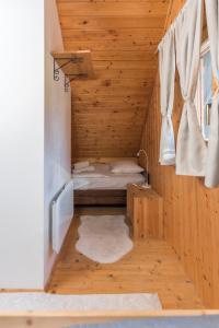Postel nebo postele na pokoji v ubytování Hike & Bike Chalet