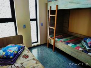 Postel nebo postele na pokoji v ubytování Tastaq hostel