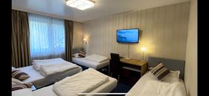 Postel nebo postele na pokoji v ubytování Hotel Austria