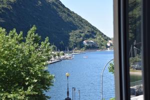 a view of a river from a window at Hotel Vela Azzurra in Malcesine