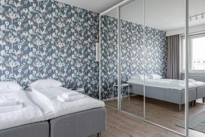 Postel nebo postele na pokoji v ubytování 2ndhomes Tampere "Puisto" Apartment