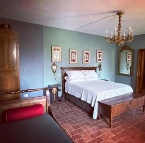 Postel nebo postele na pokoji v ubytování B&B Podere Merlo