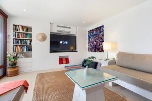 a living room with a couch and a table at Panorama Summit - Private Pool with Sunset View in Plai Laem