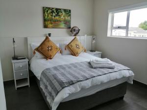 Postel nebo postele na pokoji v ubytování Syringa Villas + 9 fotografií