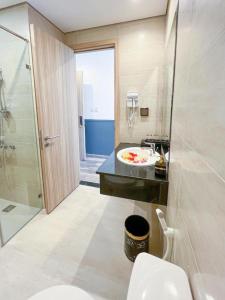 a bathroom with a toilet and a sink and a shower at Minh Phu Quoc villa beach swimming pool in Phu Quoc