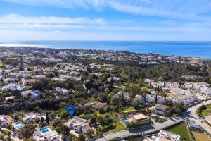 an aerial view of a city and the ocean at Casa Manjua in Carvoeiro