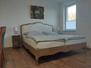 Postel nebo postele na pokoji v ubytování Jennys Hofladen