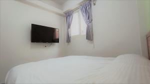 TV a/nebo společenská místnost v ubytování Fengchia Bichon B&B