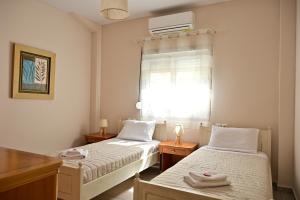 A bed or beds in a room at Spiti tou Papa sto Vouno
