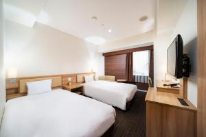 TV a/nebo společenská místnost v ubytování KOKO HOTEL Sapporo Ekimae