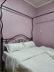 Säng eller sängar i ett rum på G&G Homes Naka Nakuru