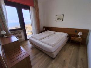 Posteľ alebo postele v izbe v ubytovaní Hotel S.Maria