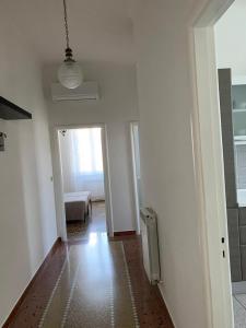 an empty room with a hallway with a door and a window at MariMARE in Sestri Levante