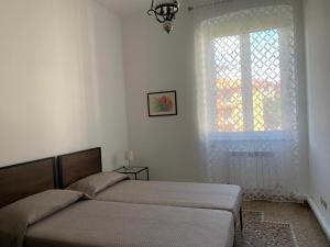 a bedroom with two beds and a window at MariMARE in Sestri Levante