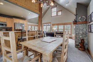 a kitchen and dining room with a wooden table at Cabin In The Pines 4 in Keystone