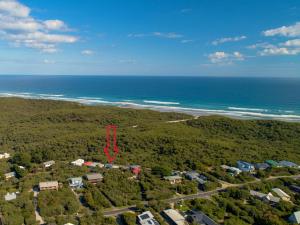 an aerial view of a house on the beach at Retro Dunes Venus Bay - WiFi, Netflix, BBQ, linens, pets OK in Venus Bay