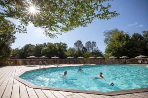 a group of people swimming in a swimming pool at CityKamp Lyon in Dardilly