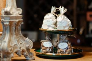 a tray of wedding shoes on a table at Piena muiža - Berghof Hotel & SPA in Sieksāte