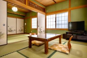 Televisyen dan/atau pusat hiburan di 由布の里 旅荘 牧場の家 Ryoso Makibanoie