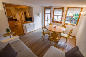 a living room with a couch and a table at Appartamenti Sonnenuhr in Sesto