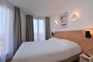 Postel nebo postele na pokoji v ubytování Residence Residéal Antibes