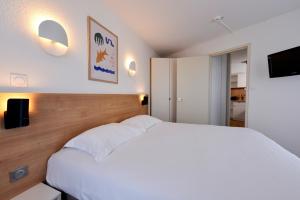 Postel nebo postele na pokoji v ubytování Residence Residéal Antibes