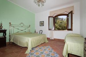 Кровать или кровати в номере Baglio Buccellato