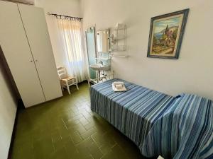 a hotel room with a bed and a sink at Bed&Breakfast Villa Lorena in Forte dei Marmi