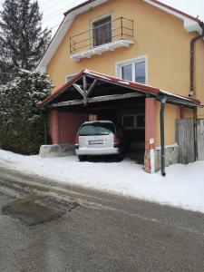 a car parked in the garage of a house at Apartmán u Moniky 