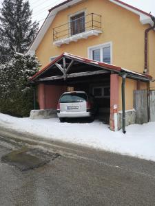 a car parked in the garage of a house at Apartmán u Moniky in Babín